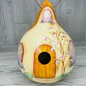 Painted gourd bird house ornately painted as a rustic fairy cottage decoration